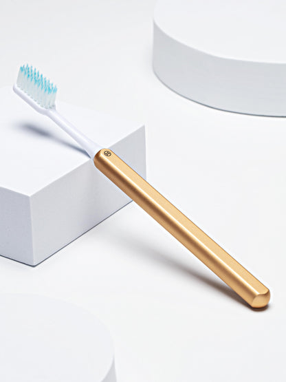 Nada Gold Toothbrush + 2 brush heads